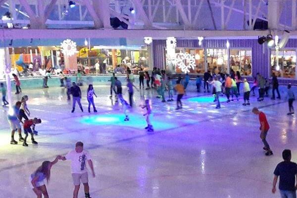 Make a snow angel on the ice rink at Galleria Ice Rink